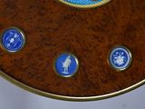 a wooden table with blue and white buttons on it