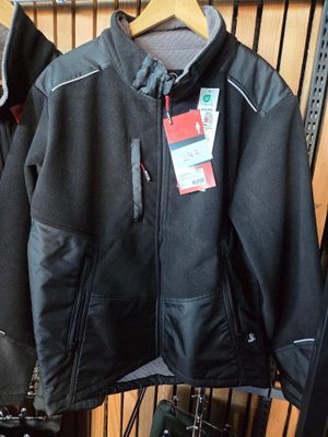 two jackets hanging on a rack in a store