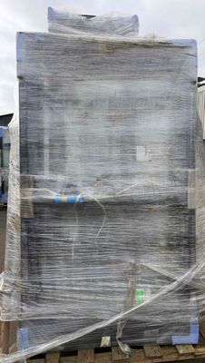 a pallet with a large box on it that is wrapped in plastic