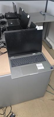 many laptops that are sitting on top of a desk
