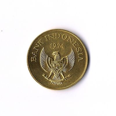 une pièce d'or sur laquelle est représenté un oiseau