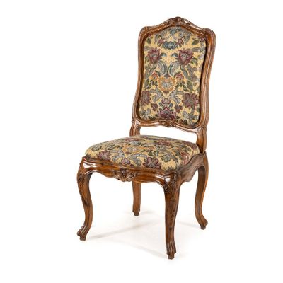an image of a wooden chair with a floral upholstered seat
