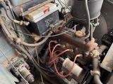 an old car engine with a lot of rust on it