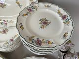 a lot of plates that are sitting on a table