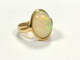 a close up of a ring with a white oplite in it