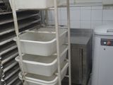 an image of a commercial kitchen with many trays of food