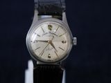 a close up of a wrist watch with a black leather strap
