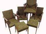 four green chairs and a stool in a circle on a white background