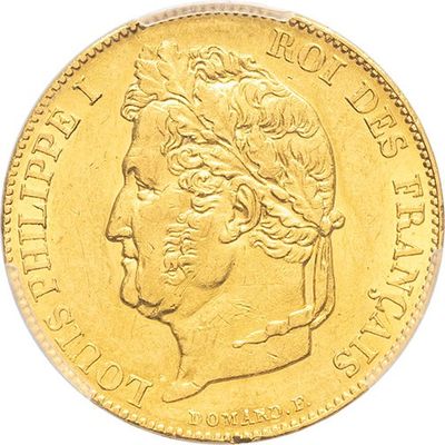 a close up of a gold coin on a white background