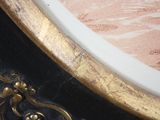 a close up of a clock with a gold trim