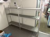 a metal shelving in the middle of a room