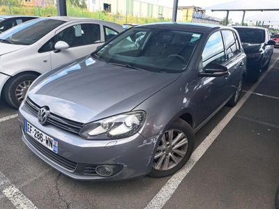 two cars parked in a parking lot next to each other