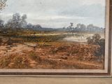 a picture of a painting of a landscape in a frame