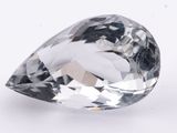 a close up of a diamond on a white surface
