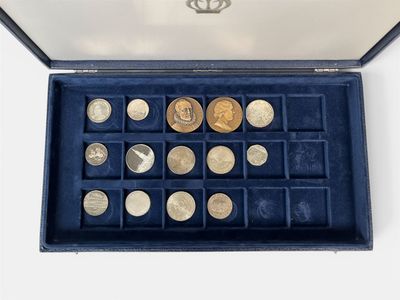 a box with a lot of coins inside of it