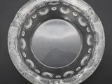 a clear glass plate with a circular design on it