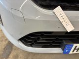 a sticker on the front of a white car