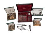 a box with silverware and other silverware in it