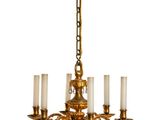 an image of a chandelier with five candles hanging from it