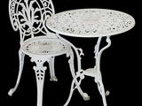 an image of a white table and two chairs on a black background