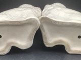 pair of white ceramic fish salt and pepper shakers