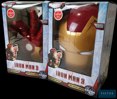 two boxes of iron man toys sitting side by side on a black background