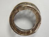 a silver ring that is sitting on top of a table