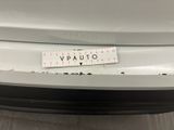 the back end of a car with a sticker that says vauto