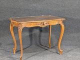 a small table with a marble top on a grey background