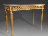 an antique console table with a marble top