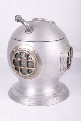 a metal object that is sitting on a white surface