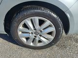 a close up of a car ' s tire on the road
