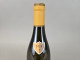 a bottle of wine that is sitting on a table