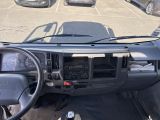 a view of the dashboard of a truck from the driver ' s seat
