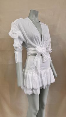 an image of a mannequin wearing a white dress