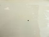 a close up of a white plate with writing on it