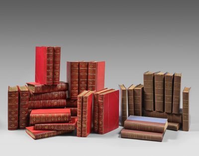 a group of books sitting on top of each other next to each other