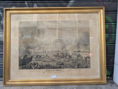 an old picture of a picture of a city in a gold frame