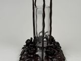 candle holder made of wood and metal with a glass on top