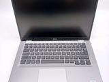 laptop with a silver keyboard on a white surface with a white background