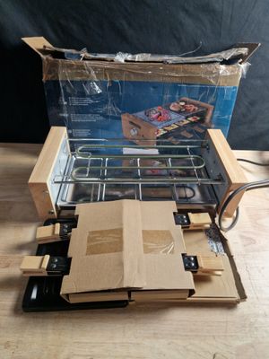 une boîte en carton dans laquelle se trouve un poêle