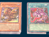two cards that are sitting side by side on a table