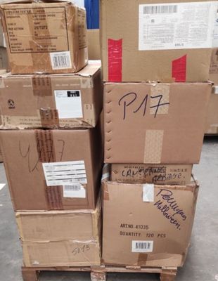 several boxes stacked on top of each other in a warehouse