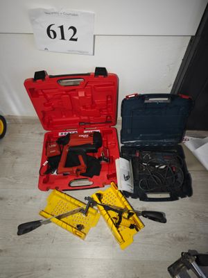 a red tool case with tools in it on the floor