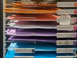 a lot of folders on the shelves in the store