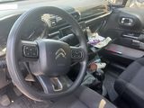 the interior of a car with a steering wheel and dashboard