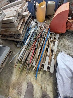 a pile of wood and tools sitting on the ground