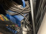 a hose and a hose holder in the back of a truck