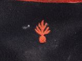 an image of a black hat with a red flower on it