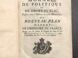 an open book with a picture of a coat of arms on it